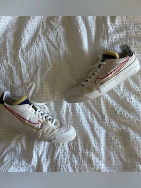 Nike White Low-Top Sneakers with Red Swoosh